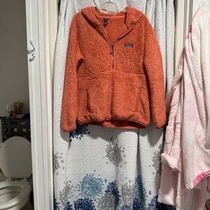 Patagonia women ' Fleece Hoodie in Warm Orange